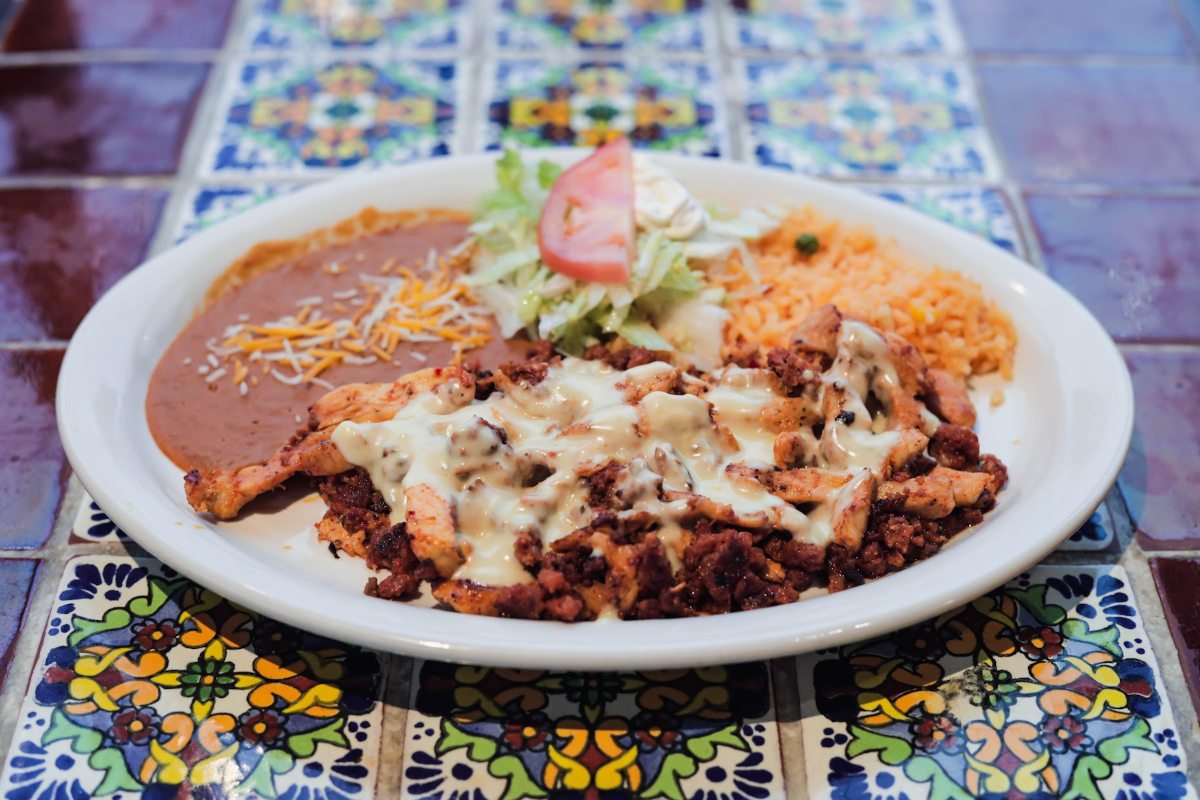 Meat with dip, rice and salad on the side